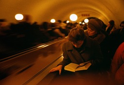 A woman reading on the metro, Moscow, 1993